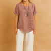 Liva | Asymmetrical blouse with decorative clasp